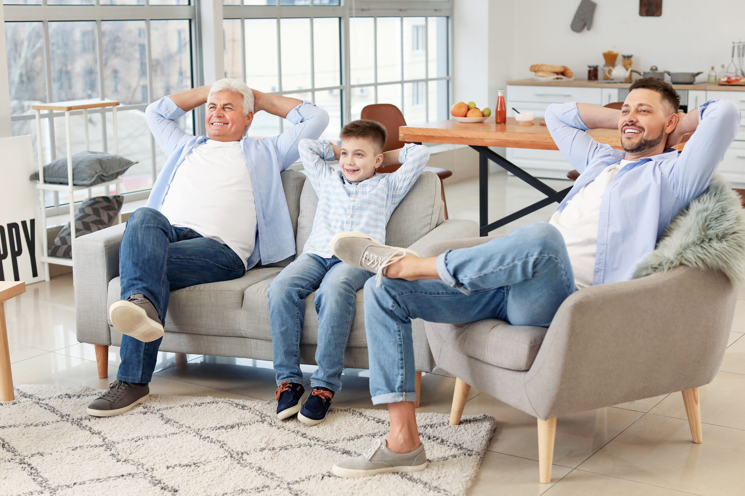 Man,With,His,Father,And,Son,Resting,At,Home