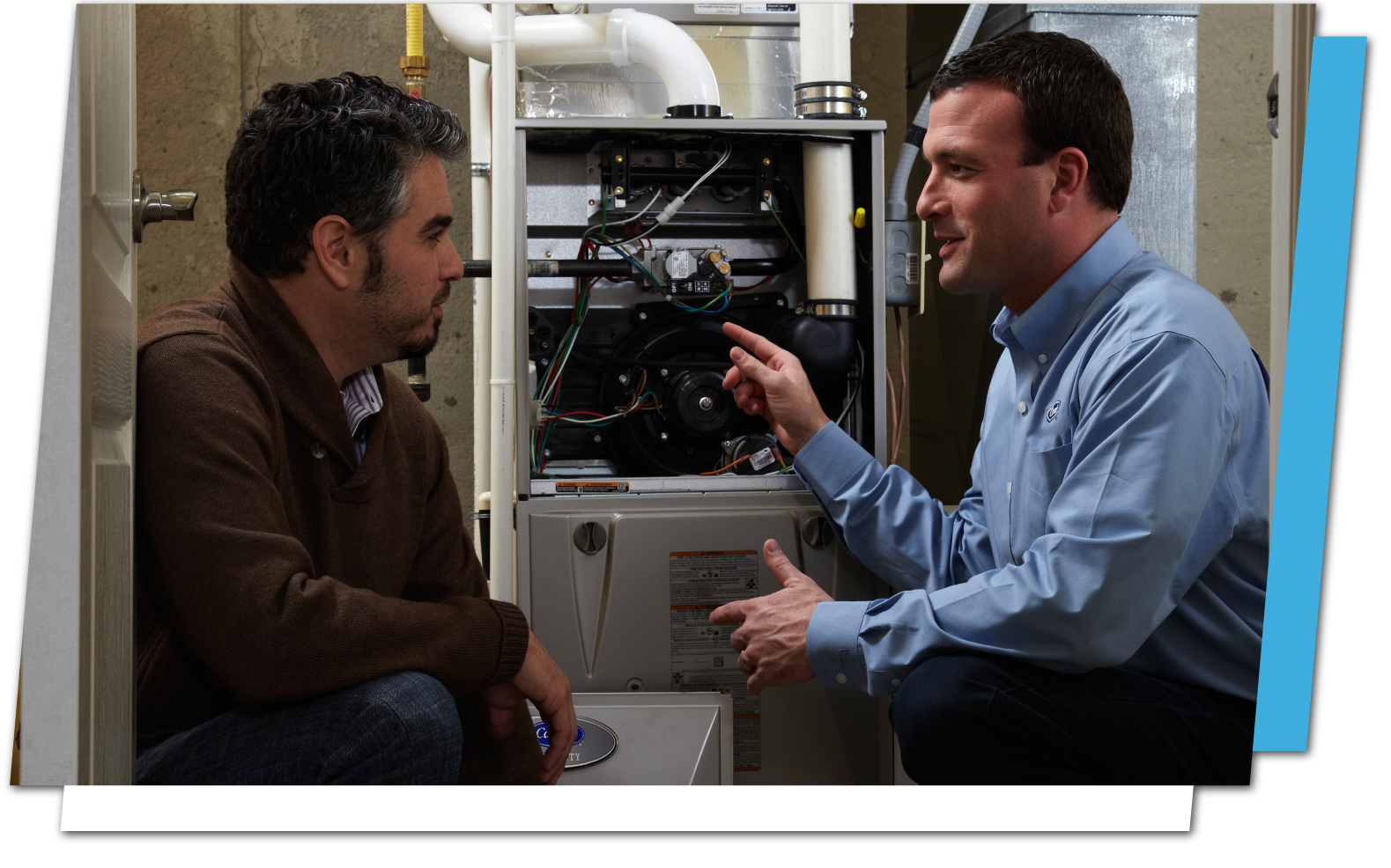 Residential Service & Maintenance - Tech explaining to a customer what maintenance needs to be done on their furnace.
